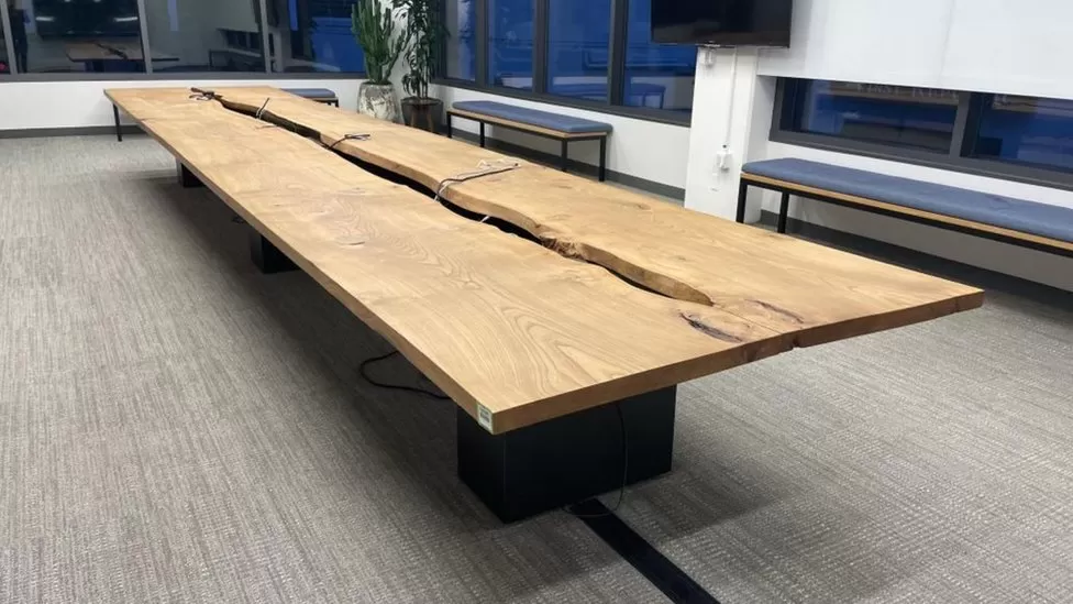 photo of a wooden table in twitter office